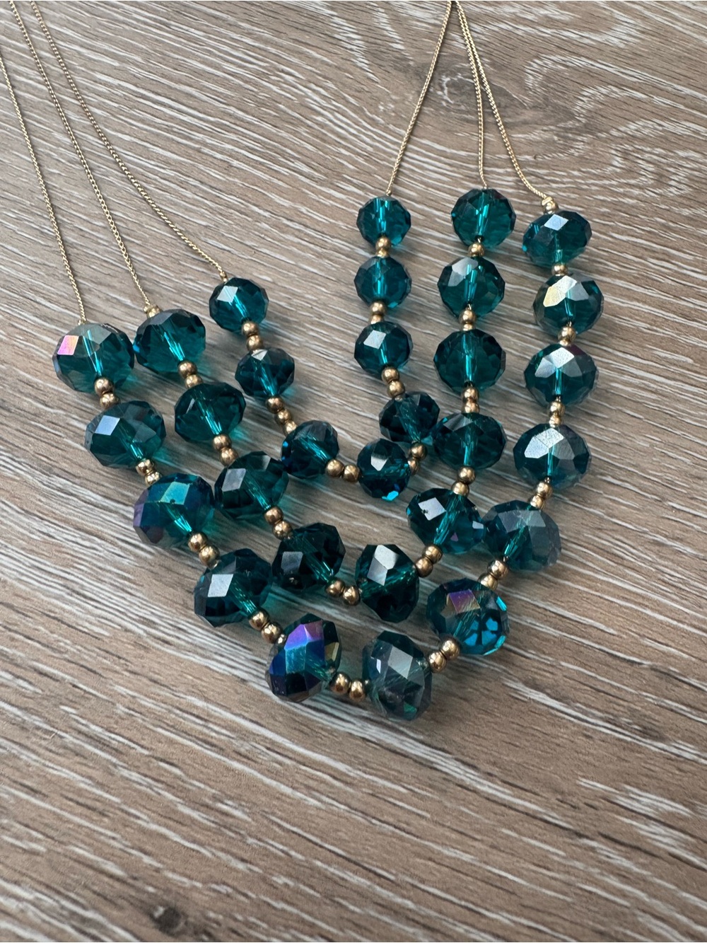Blue crystal multi layered gold tone necklace